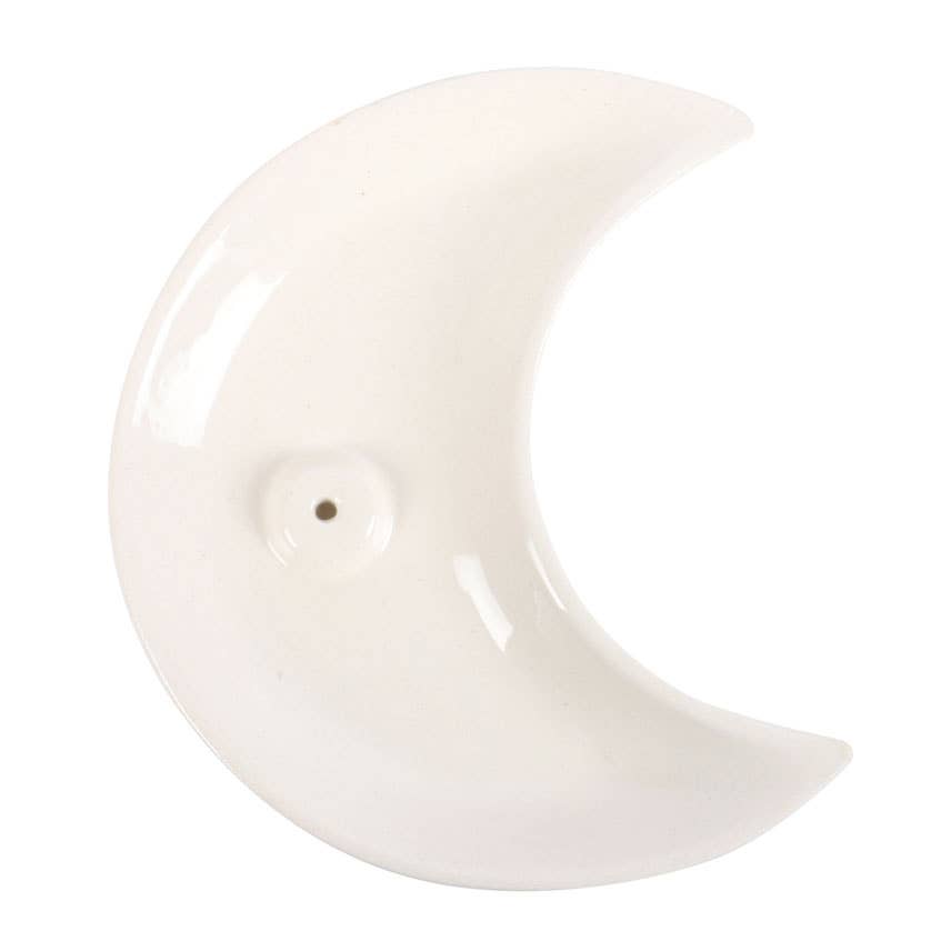 White ceramic crescent moon-shaped object on a white background