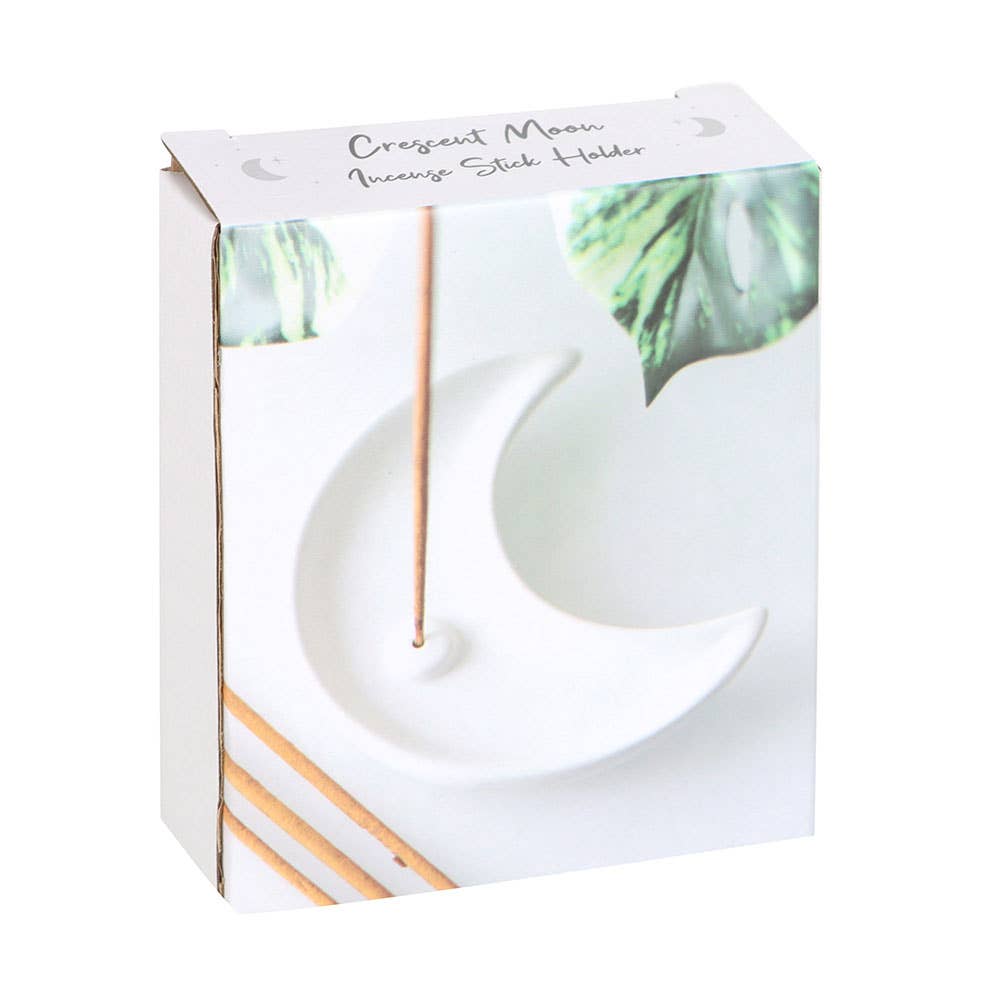 Crescent moon incense stick holder in packaging with decorative elements