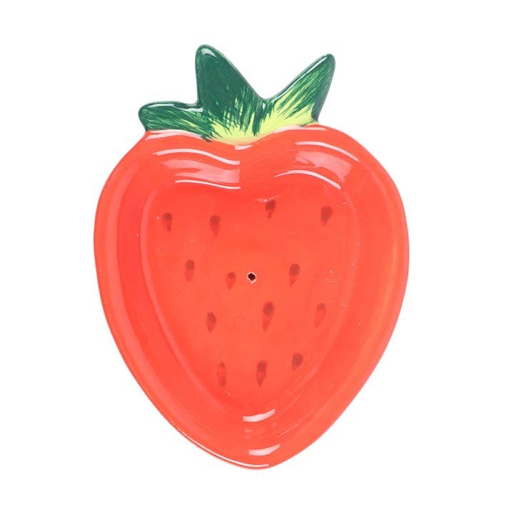 Red strawberry-shaped object with a green leaf on a white background