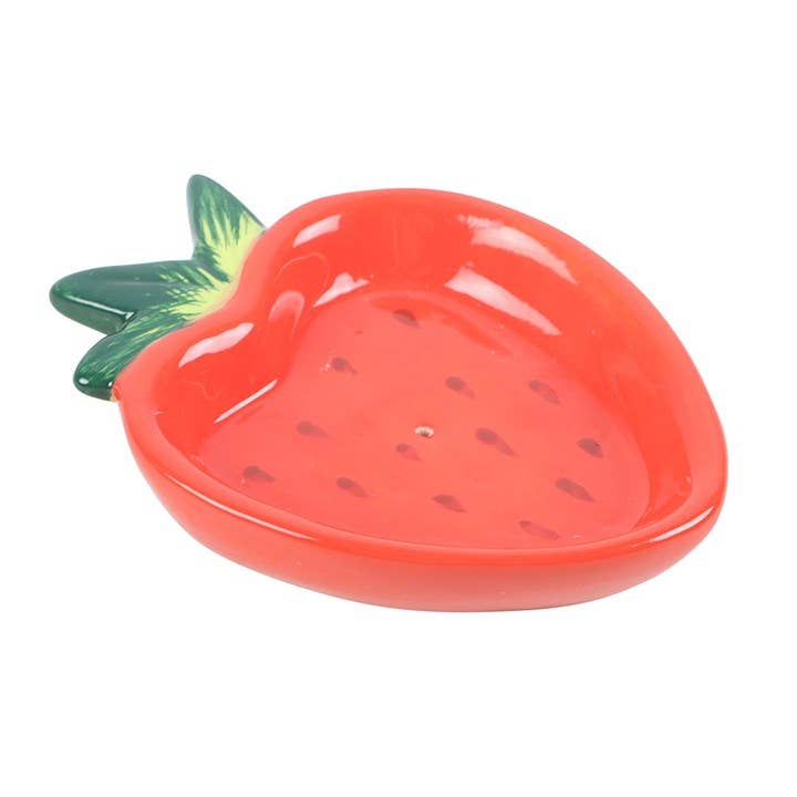 Strawberry-shaped dish with green stem on a white background
