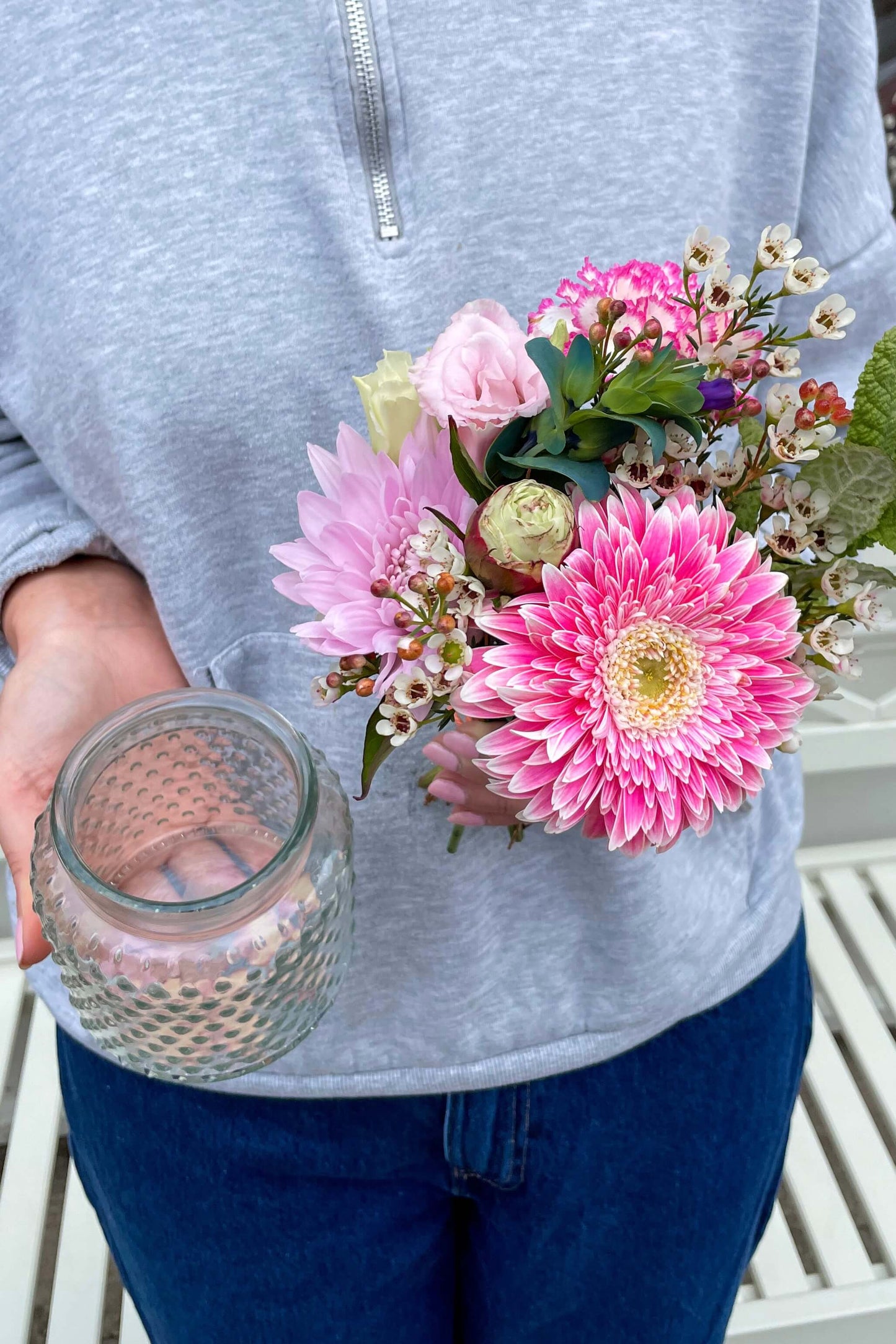 Baby Blooms mini seasonal posy with a pink gerbera, seasonal flowers and a glass vase.