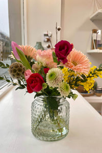 Baby Blooms mini seasonal posy arranged in a clear glass vase