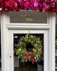 Noel fresh luxury wreath on the door of Blush Blooms