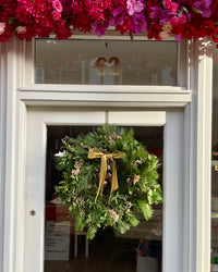 The Nordic Fresh Luxury Wreath on the door of Blush Blooms in Stonehaven