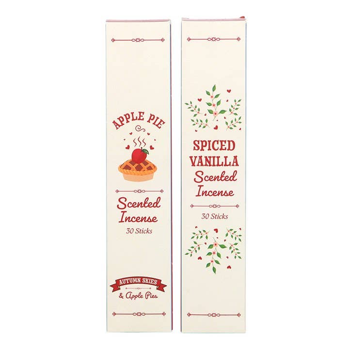 Two packages of spiced vanilla and apple pie scented incense on a white background