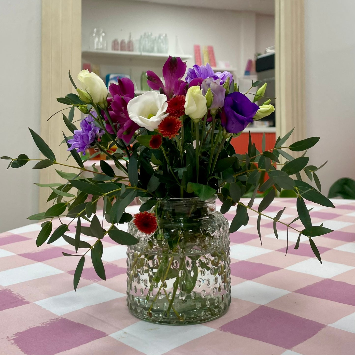 Baby Blooms seasonal stems in a clear vase in Stonehaven florist