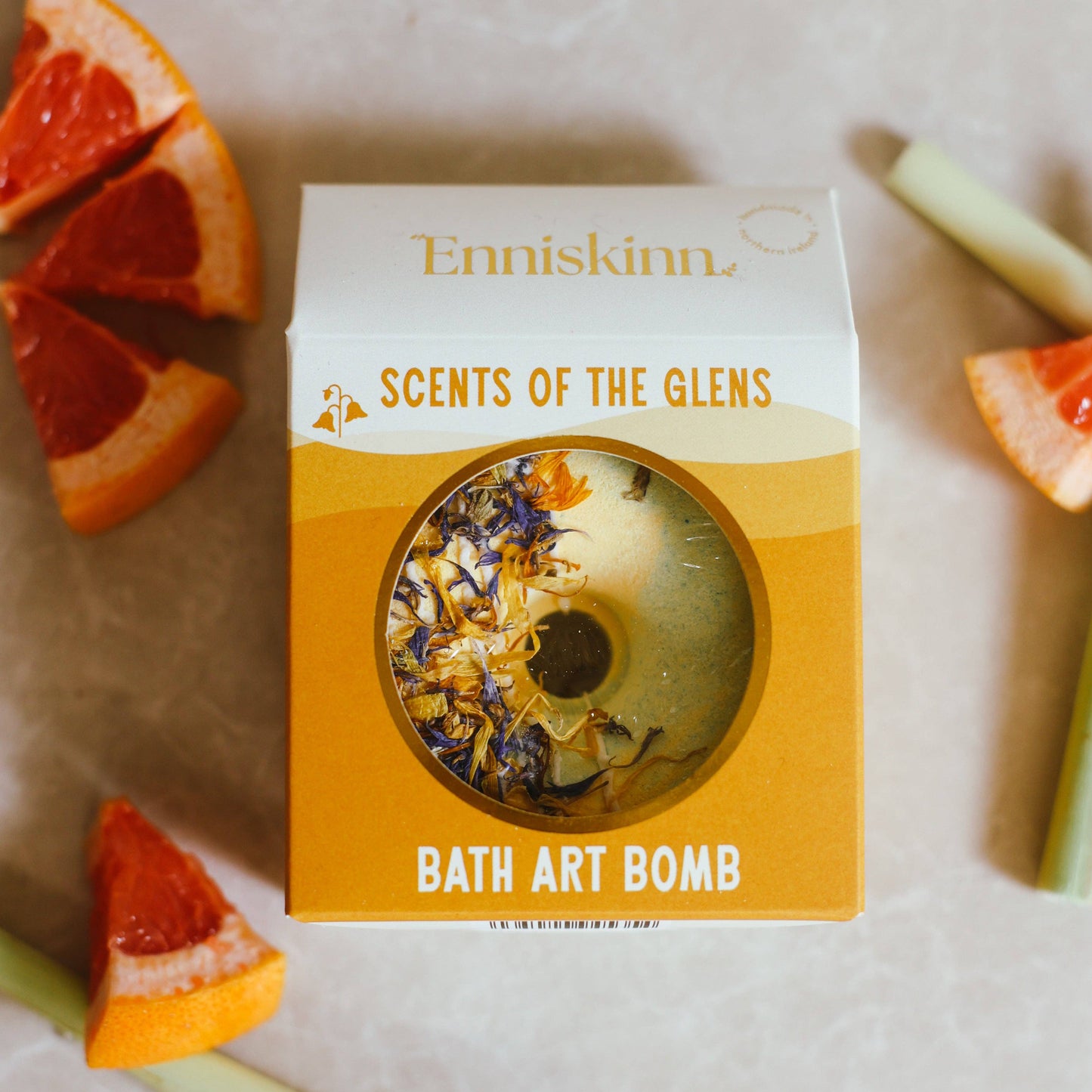 Enniskinn bath art bomb packaging with grapefruit slices on a light background