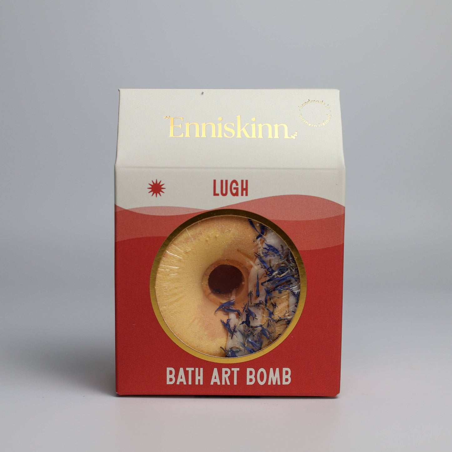 Enniskinn Lugh Bath Art Bomb packaging on a gray background