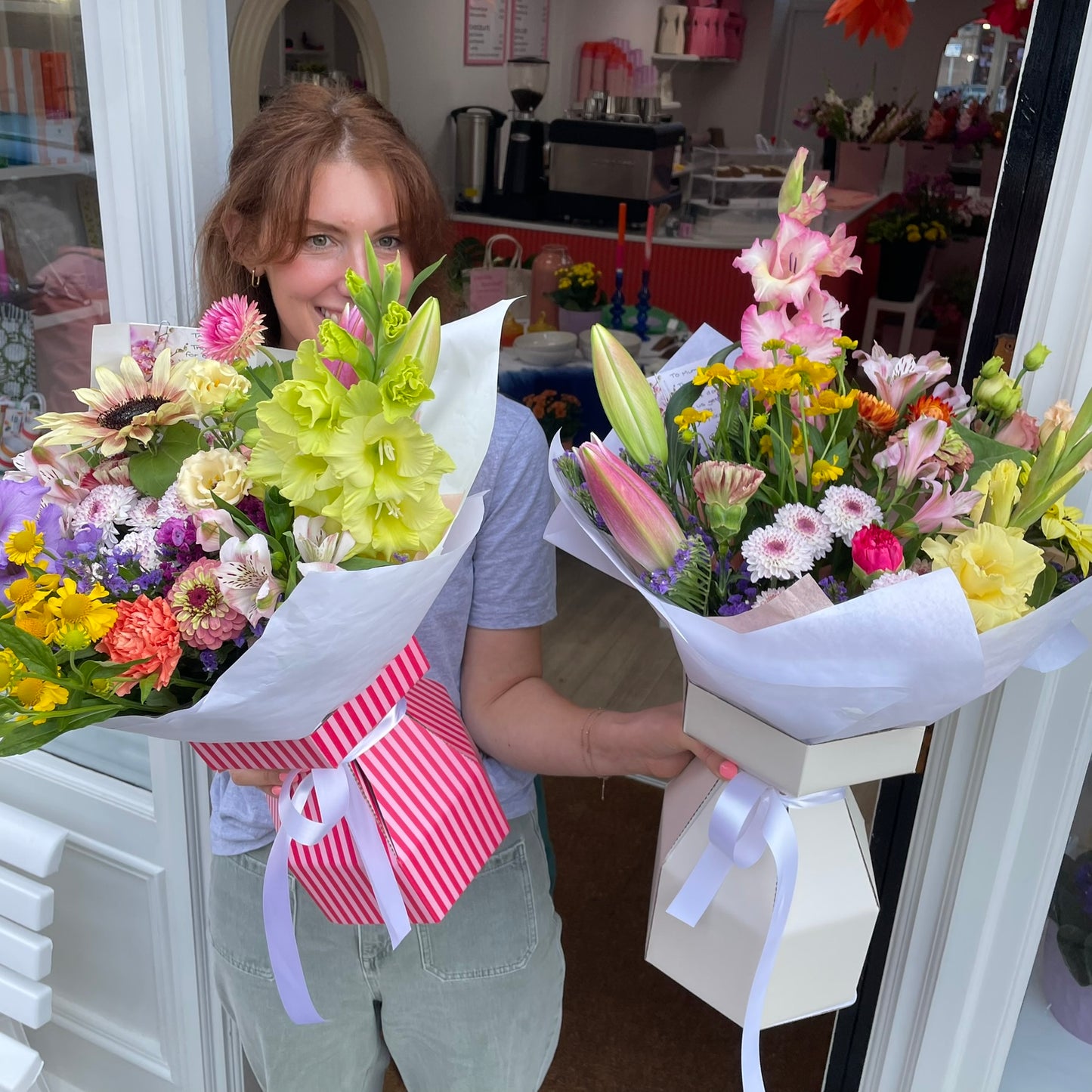 Florist holding two luxury bouquets outside Aberdeenshire florist