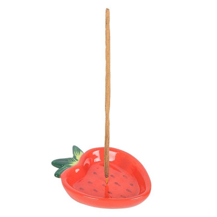 Strawberry-shaped incense holder with a single stick on a white background