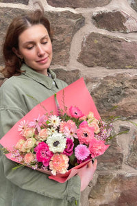 Candy Floss spring bouquet with mixed pink flowers including spray roses, ranunculus and anemones.