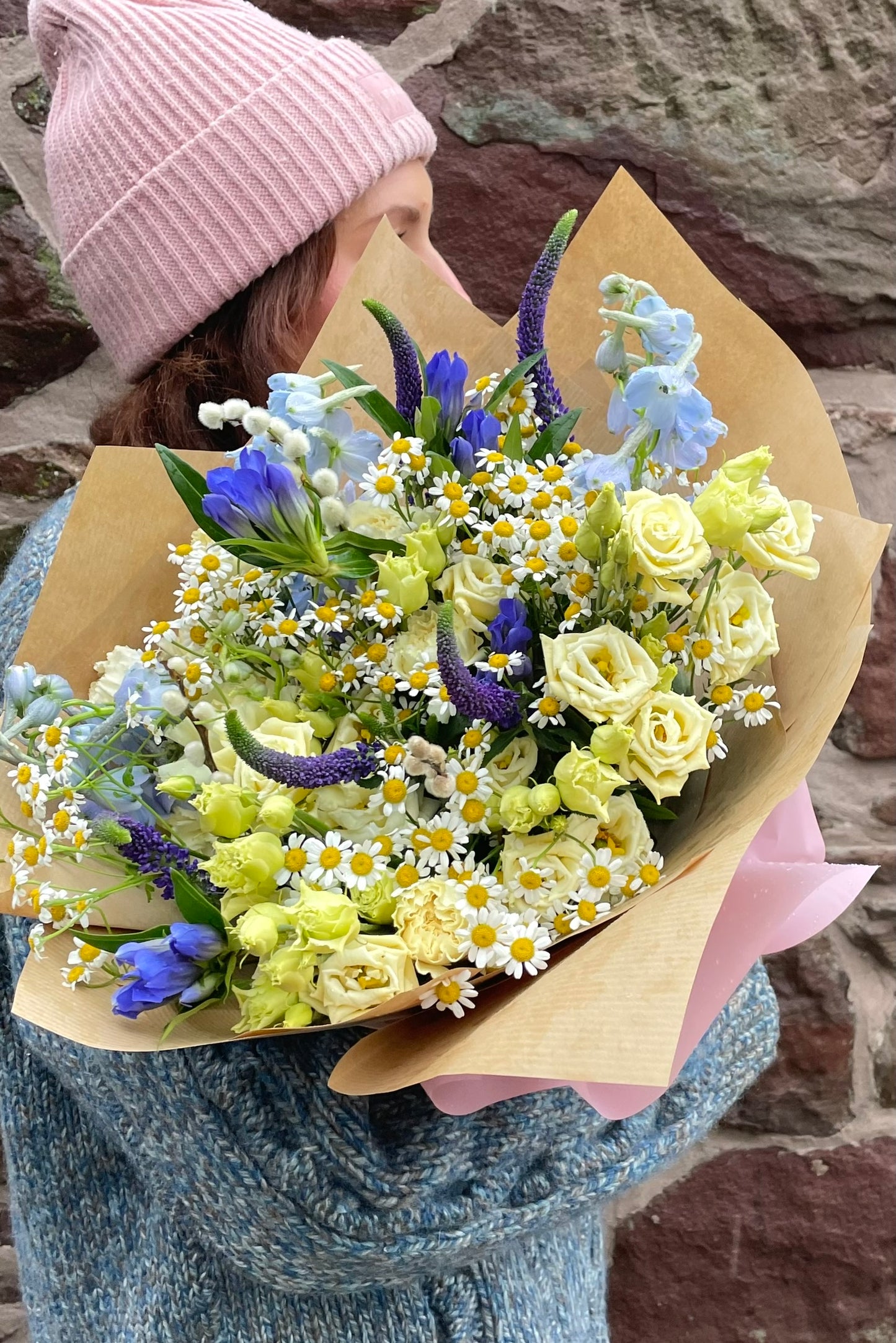 Love, Always Valentine’s bouquet featuring cream and butter yellow flowers with lisianthus, delphiniums, daisies, gentiana, veronica and carnations