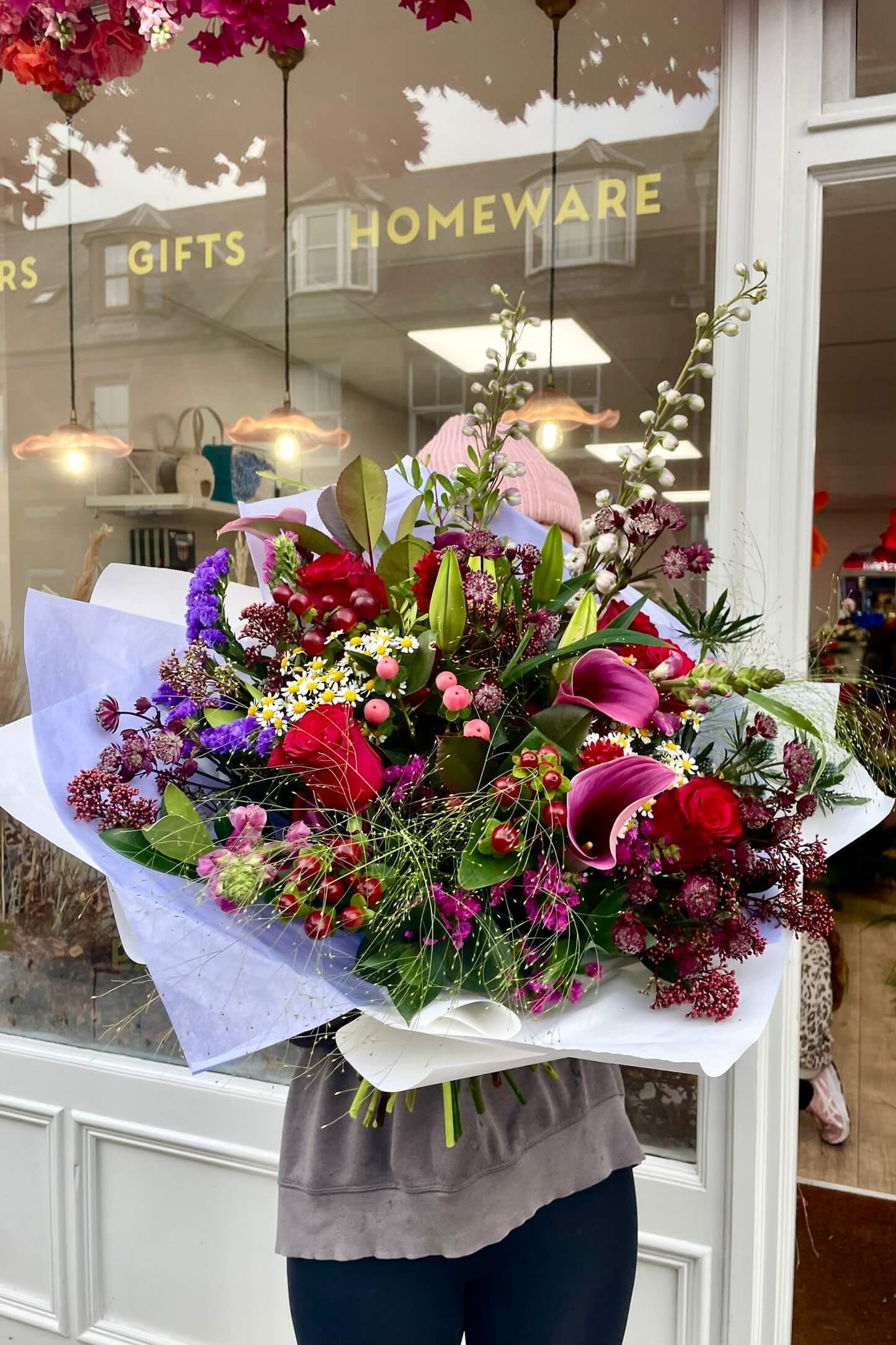 Mid-range view of a luxury bespoke bouquet, flowers and colours may vary